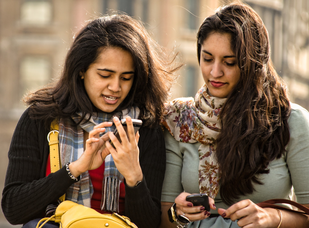 Now, instead of texting each other, you can text other people. Photo by Gary Knight.